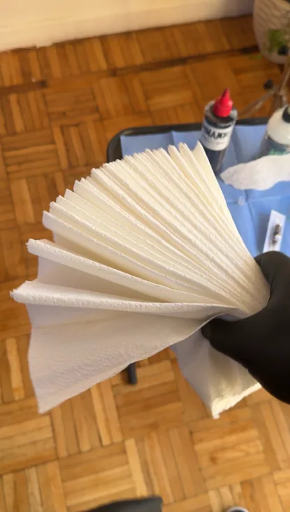 Fresh paper towels laid out on the prepared tray at MORSE INK